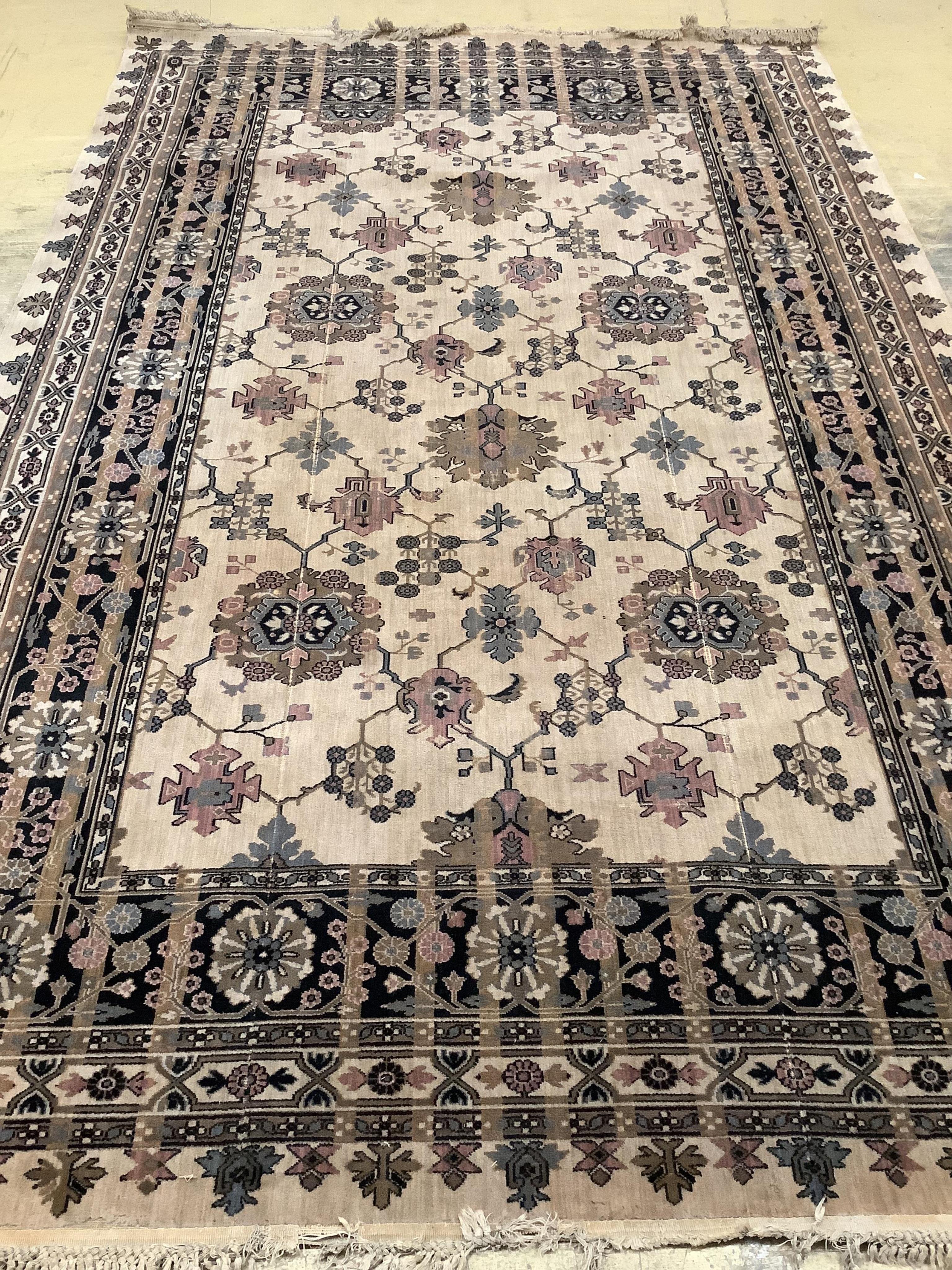A Hamadan ivory ground carpet, 325 x 205cm